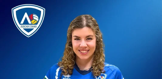 ВК Левски взе шампионка от Марица Smiling young woman in a blue Levski Sofia volleyball jersey against a blue backdrop with the club logo on her left chest.