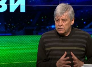 Емил Спасов: Левски може да вземе точки, но лесни мачове няма Man with gray hair in a black and gray striped sweater speaks on a TV talk-show set with a green backdrop.