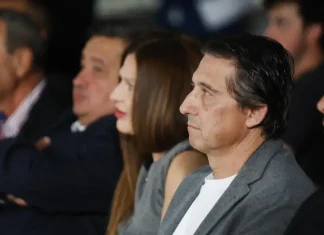 Боримиров за Купата: Левски няма да подценява съперника Side profile of a middle-aged man in a gray blazer and white shirt, attentively watching an event in a audience setting
