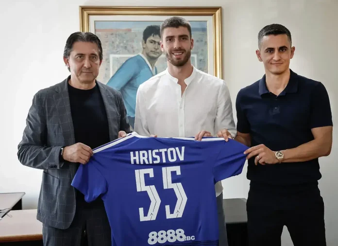 Three men stand indoors, smiling, holding a blue jersey that reads 'HRISTOV 55' with '8888.bg' on it.