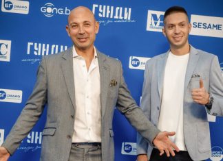 Пелето за Левски: Отборът надмина очакванията ми, но има неща, които трябва да се оправят Two men in light gray blazers pose and smile in front of a blue event backdrop covered with sponsor logos, arms open.