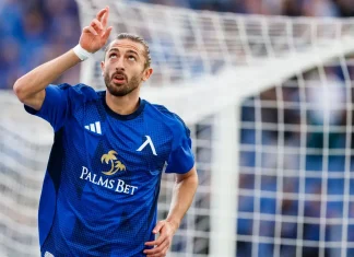 Шестима от Левски получиха повиквателни за националните отбори Soccer player in a blue kit celebrates near the goal net, looking upward.