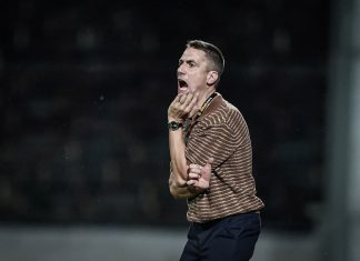 Веласкес след успеха над Славия: Показахме характер и класа Man on a sports field shouting with his hand near his mouth, wearing a brown striped polo shirt and watch on his left wrist.