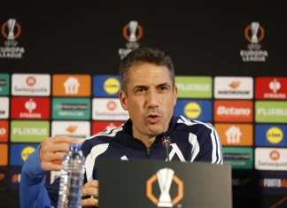 Бранител може да остане извън групата за Черно море Man in a navy jacket speaks at a press conference, seated behind a table with a microphone and a colorful sponsor backdrop behind him.