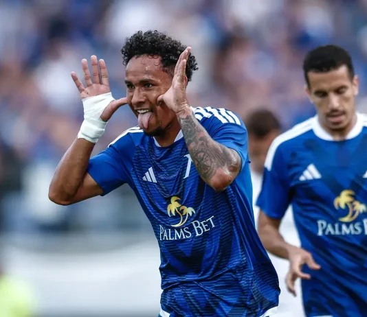 Футболист на Левски попадна в топ 5 на престижна европейска класация Two soccer players in blue celebrate on the pitch; foreground player cups his ears and sticks out his tongue.