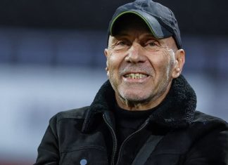 Георги Василев очаква сериозна битка за титлата Smiling man wearing a dark cap and black jacket, looking at the camera outdoors.