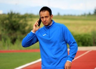Кирил Лулев за Левски, битката за титлата и новите треньори на ЦСКА и Лудогорец Man in a blue athletic jacket on a running track, talking on a smartphone.