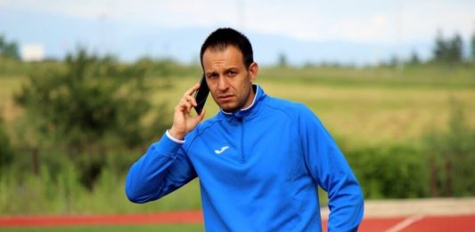 Кирил Лулев за Левски, битката за титлата и новите треньори на ЦСКА и Лудогорец Man in a blue athletic jacket on a running track, talking on a smartphone.