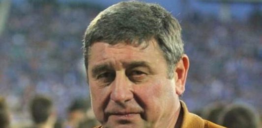 Легендата на Левски Мишо Вълчев на 70 Close-up of a middle-aged man with short gray hair wearing an orange jacket at a crowded event.