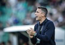 Левски готви зимен трансферен удар с нов вратар и централен защитник Coach shouting encouragement on the sideline, hands clasped, stadium crowd in the background.
