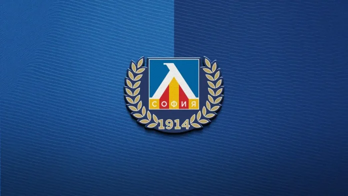 Emblem with a blue shield, white triangular arch, red and yellow bars, flanked by gold laurel branches, and ‘1914’ beneath on a blue textured background, resembling a union logo