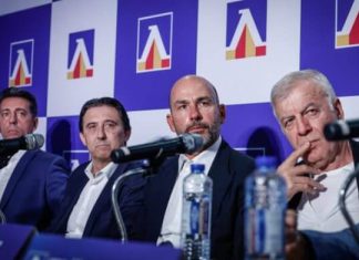 Левски обмисля важна промяна в школата, която може да спре отлива на таланти към конкурентите Four men in suits sit at a panel with microphones, water bottles, and a blue backdrop featuring logos behind them (press conference).