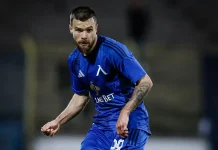 Левски остава без Радослав Кирилов до края на годината! Националът претърпя втора операция Soccer player in a blue kit sprinting on a dim field, LMS BET sponsor logo visible.
