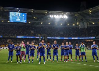 Левски пише история в Европа! „Сините“ гонят рекорд на Лудогорец Soccer team in blue uniforms lined up on the grass field after a match in a large stadium, fans in the stands applauding.