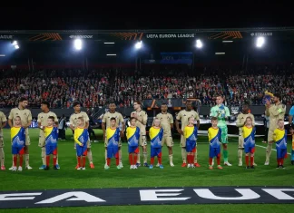 Левски впечатлява с дисциплина в Европа: само 15 жълти картона в 11 мача Soccer players lined up with young mascots on the field before a match, stadium filled with fans in the background.