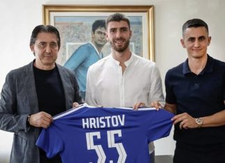 Петко Христов още чака своя шанс в Левски Three men stand indoors, presenting a blue sports jersey labeled Hristov 55.