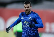 Радослав Кирилов – профил и кариера на футболиста Male soccer goalkeeper in a blue kit and gloves, sprinting on the field during practice or a match.