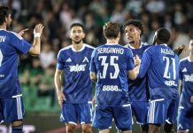 Веласкес избра титулярите за мача със Спартак Плевен Soccer players in blue uniforms celebrate together on a field after a goal, with arms raised and smiling faces, a crowded stadium in the background.