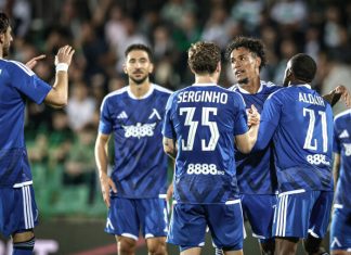 Веласкес избра титулярите за мача със Спартак Плевен Soccer players in blue uniforms celebrate together on a field after a goal, with arms raised and smiling faces, a crowded stadium in the background.